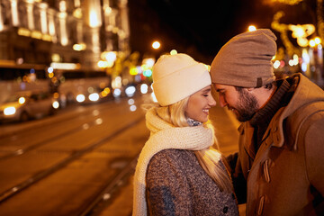A young couple in a walk is so happy and in love. Relationship, together, Xmas