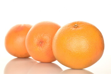organic ripe grapefruits, close-up, isolated on white.