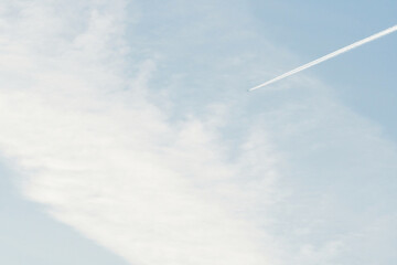 airplane in the sky with clouds