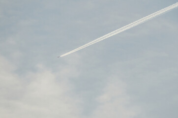 airplane in the sky with clouds