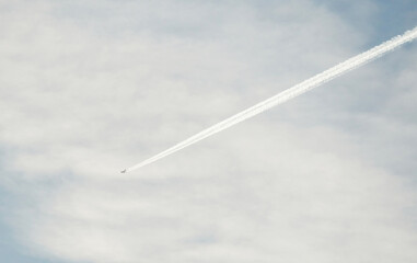 airplane in the sky with clouds