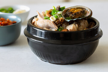 Ginseng chicken soup with abalone which is called Jeonbok Samgyetang