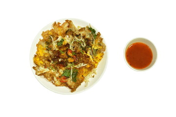 crispy fried mussel and egg omelet with bean sprout dipping chili sauce on white background