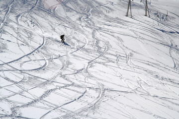 Fototapeta premium Descent of a snowboarder on the slope of Mount Cheget, Elbrus region, Caucasus