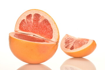 organic ripe grapefruits, close-up, isolated on white.