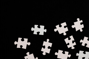 Naklejka premium puzzle on a black background