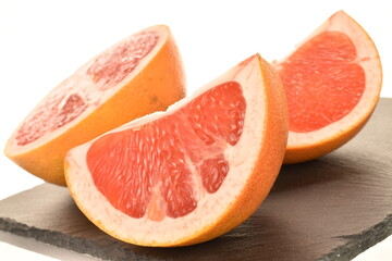 Fototapeta na wymiar organic ripe grapefruits, close-up, isolated on white.