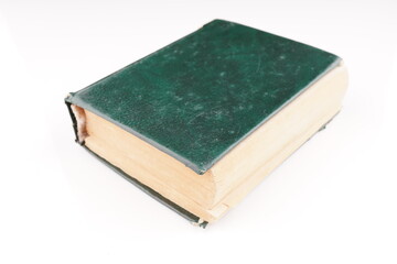 old green dictionary on white background