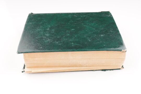 old green dictionary on white background