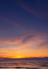 Fototapeta na wymiar Sunset sky over sea in the evening with nature sunlight on twilight, dusk sky vertical 