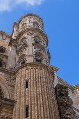 Fototapeta na wymiar View of South facade of Cathedral of Malaga. Renaissance Cathedral - Roman Catholic Church in the city of Malaga, constructed between 1528 and 1782. Malaga, Costa del Sol, Andalusia, Spain.