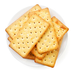 Heap of salty crackers in a plate on a white background. Top view