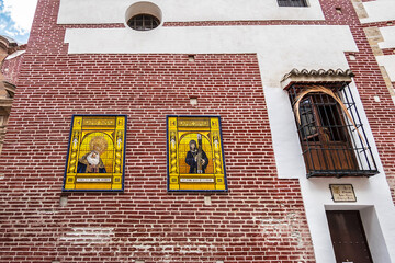 Obraz premium Christian Church of Holy Martyrs (Iglesia de los Santos Martires, 1494). It erected in honor of martyrs San Ciriaco and Santa Paula, patrons of city. Malaga, Costa del Sol, Andalusia, Spain.
