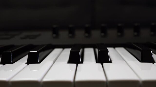 Modern professional piano in a music studio.