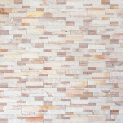 Sandstone wall background of white golden sand stone jigsaw tile, rock brick modern texture pattern for backdrop decoration