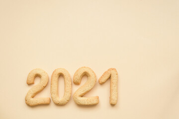 flat lay composition of gingerbread gingerbread figures 2021 home baking on the background of Set Sail Champagne-beige trend of 2021