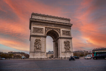Orange sunset at the Arc de Triomphe in the beautiful European city of Paris. France