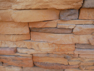 Slate brick in earth tone colour used as wall finishes. Installed overlap according to the method recommended by the manufacturer to get the maximum effect.
