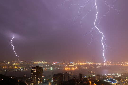 Lightning storm over night city.