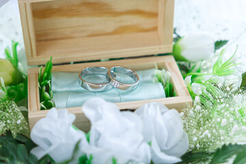 Fototapeta na wymiar Pair of Wedding Rings in the Wood Box in the Wedding Ceremony Day.