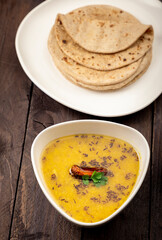 traditional indian meal lentil soup, flat bread and cauliflower vegetable, dal, roti and sabzi