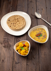 traditional indian meal lentil soup, flat bread and cauliflower vegetable, dal, roti and sabzi