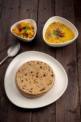 traditional indian meal lentil soup, flat bread and cauliflower vegetable, dal, roti and sabzi