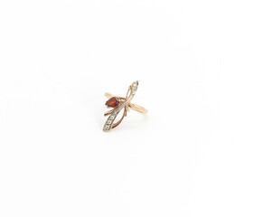 gold ring with a stone on a white background