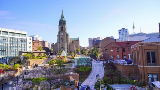 People climb the stairs of Myeongdong Cathedral in the daytime. Seoul City Center, South Korea