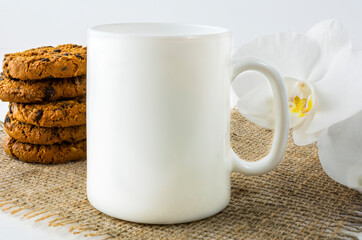 Coffee mug mockup with chocolates cookies