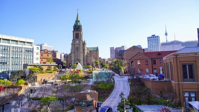People climb the stairs of Myeongdong Cathedral in the daytime. Seoul City Center, South Korea.