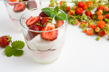 Fresh layered strawberry dessert with yogurt