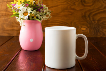 Placeit-White coffee mug mockup with field flowers