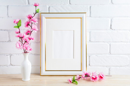 Placeit-White frame mockup with pink spring flower bunch