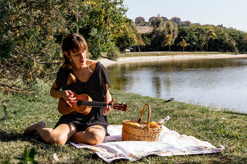 Woman playing ukulele