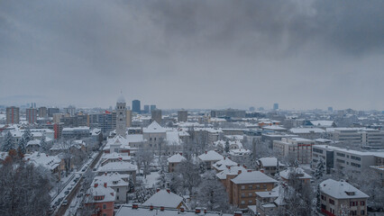 Winter aerial panorama of northern part of ljubljana or Poljane viewed from Castle Hill. Hazy cold weather.