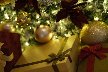 close up christmas gifts below christmas tree