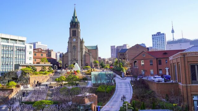People climb the stairs of Myeongdong Cathedral in the daytime. Seoul City Center, South Korea
