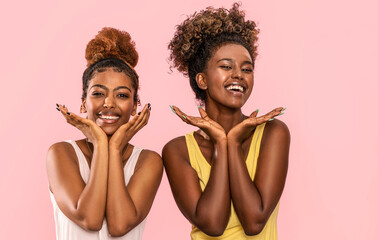 Happy overjoyed two afro women smile broadly