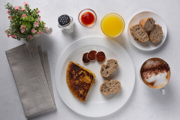 Spanish omelette, served with bread, tomato paste and chorizo. Delicious typical Spanish breakfast