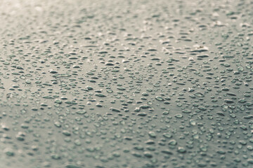 Water drops on smooth surface of waterproof fabric