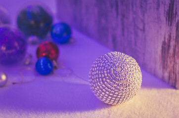 Luxurious christmas silver ball decoration in duotone purple shadows