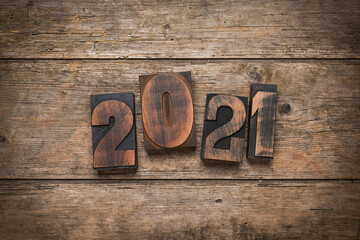Year 2021 set with vintage prining blocks on rustic wooden background
