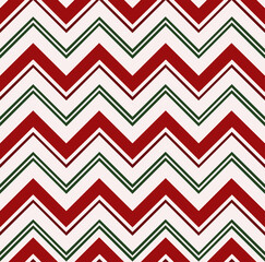 Seamless Christmas pattern with red and green zigzags. Winter festive retro style background