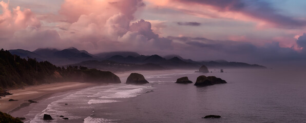 Cannon Beach, Oregon, United States. Beautiful Aerial Panoramic View of the Rocky Pacific Ocean Coast. Dramatic Colorful Sunrise Sky.
