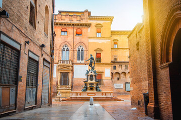 Neptune fountain Bologna, Italy - medieval bricks town with archs. Sunrise moment  © Giampaolo