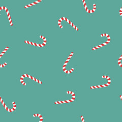 Vector seamless pattern with Christmas candy on green background. Christmas concept for wrapping, wallpaper or backdrop