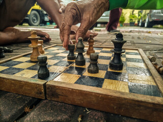 playing chess by the side of the road wastes time