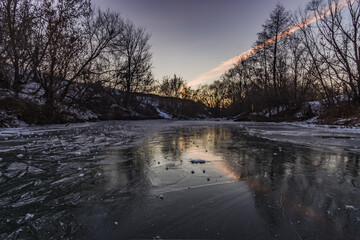 winter landscape on a frozen river in severe frost