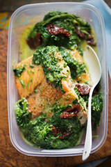 Baked salmon with spinach and sun dried tomatoes 
